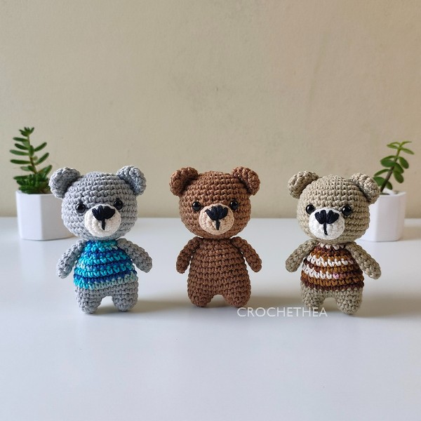 Three small crochet bear toys all made in different colourways.