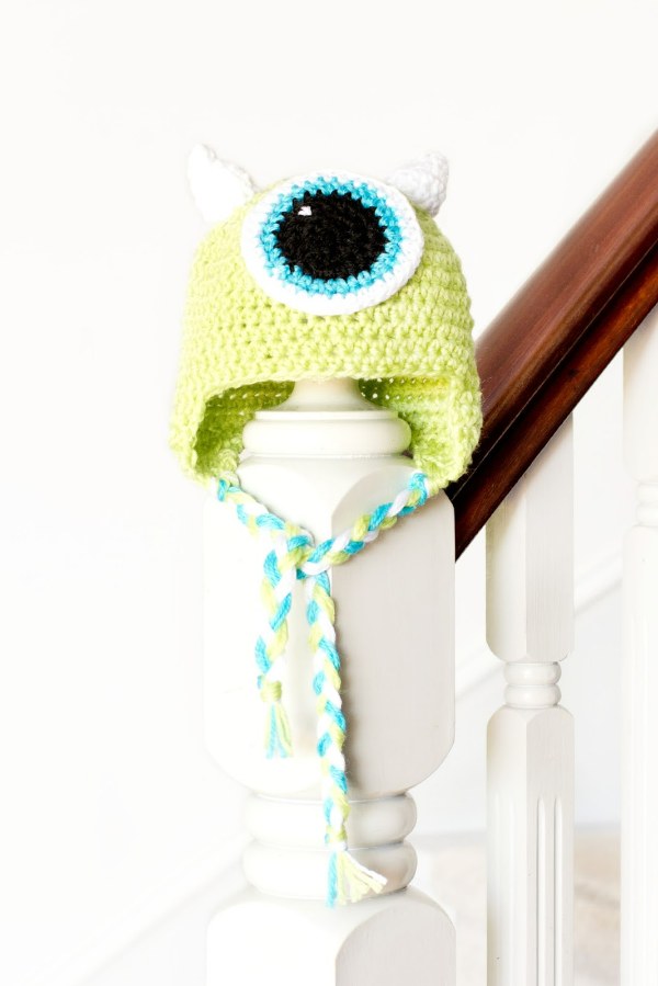 a Mike Wazowksi monster crochet hat with earflaps.