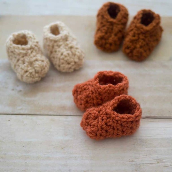 Three pairs of crochet baby boots.