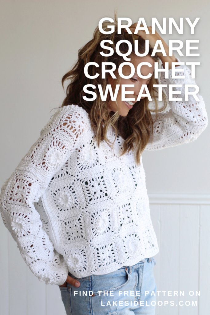 A woman wearing a loose-fit white crochet granny square sweater.