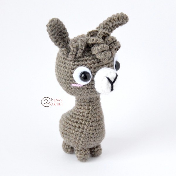 A cute cartoon-style crochet llama amigurumi.