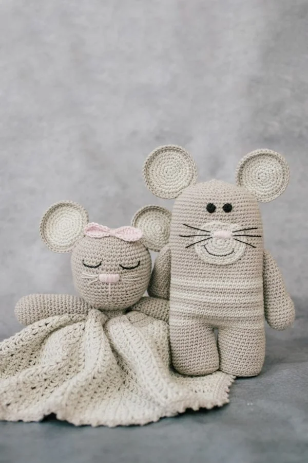A mouse-themed crochet lovey and a mouse snuggle toy.