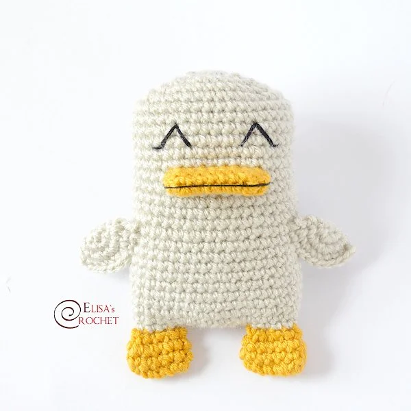 A small crochet baby duck toy.