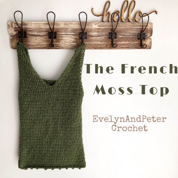 A green crochet top with a v-neck.