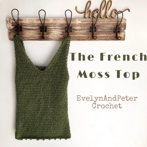 A green crochet top with a v-neck.