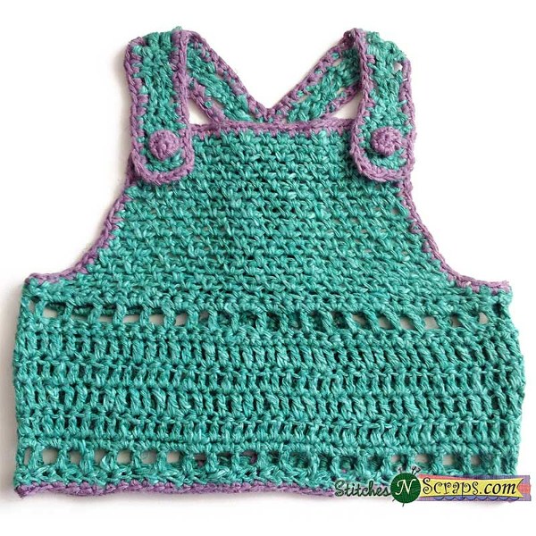 A pinafore style crochet baby top.