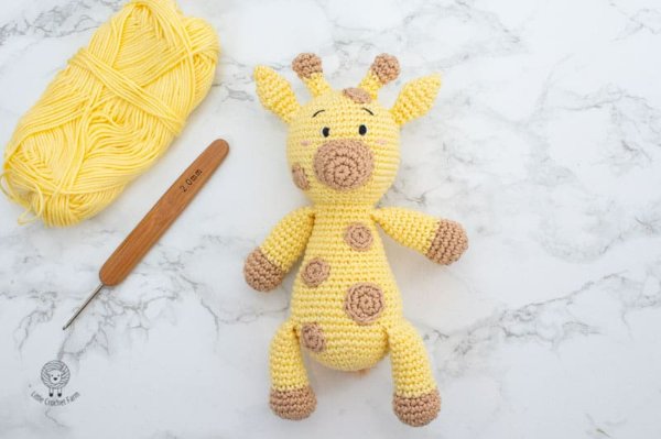 A soft and floppy crochet giraffe.