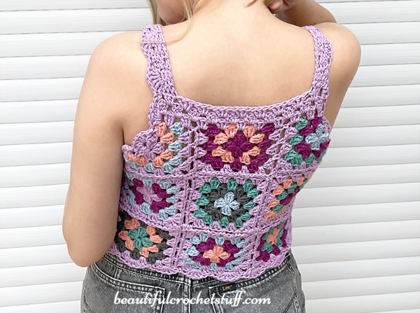 Back view of a crochet granny square top.