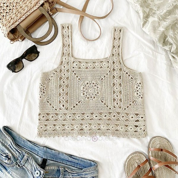 A cropped crochet tank top featuring granny squares.