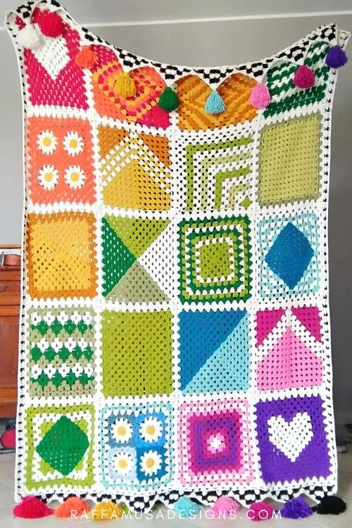 A brightly coloured granny square sampler blanket.