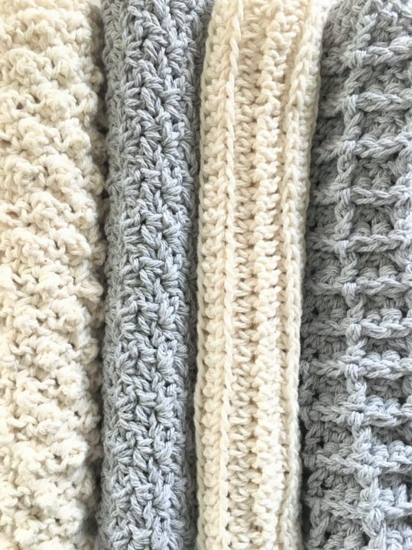 A set of crochet washcloths worked in different stitch patterns.