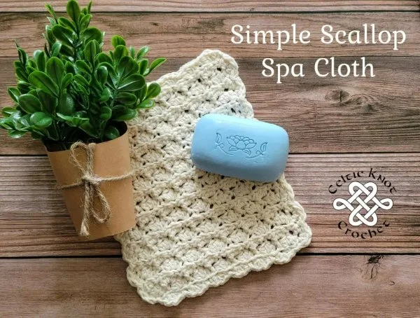 A crochet washcloth with a scalloped edge.