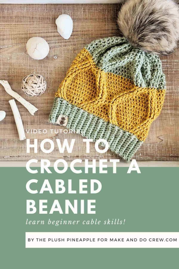 A colour blocked cable crochet hat.
