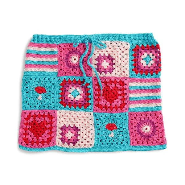 A patchwork granny square style crochet mini skirt with drawstring waist.