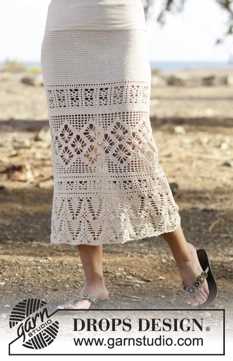 A long crochet skirt with a lacy design.