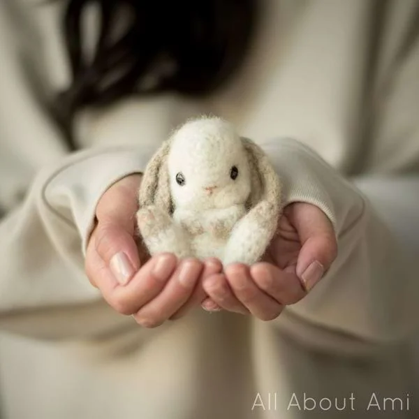 A small fluffy white crochet rabbit.