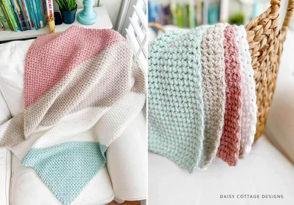 A pastel-coloured corner-to-corner crochet blanket draped over a sofa.