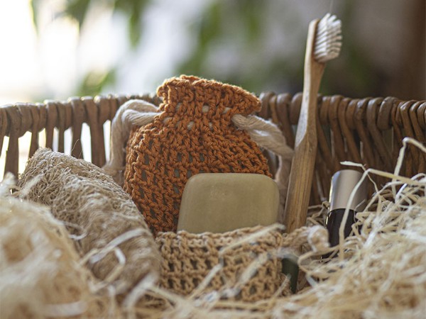 Crochet soap holders in a basket.