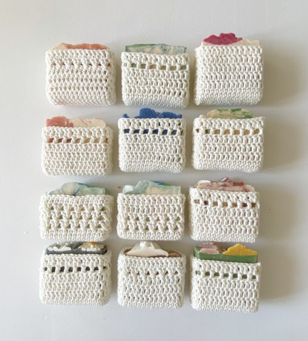 12 soaps in white crochet pockets.