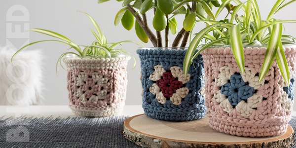 Three granny square crochet plant baskets.