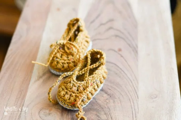 Beautiful mustard-yellow vintage-style crochet baby booties.