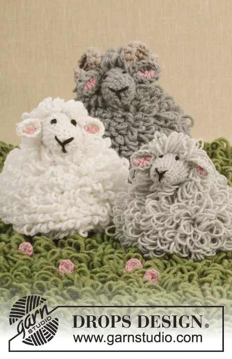 Three crochet sheep amigurumi with loop stitch fleeces.