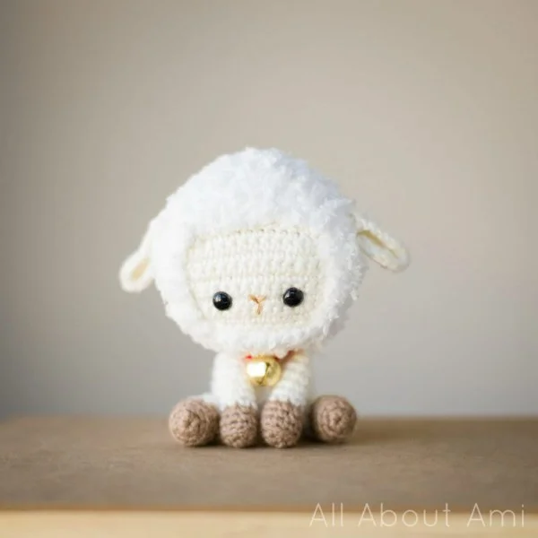 An amigurumi sheep with a big head.