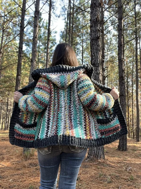 A striped crochet hoodie with black ribbing.