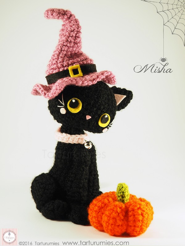 A halloween-themed black cat amigurumi.