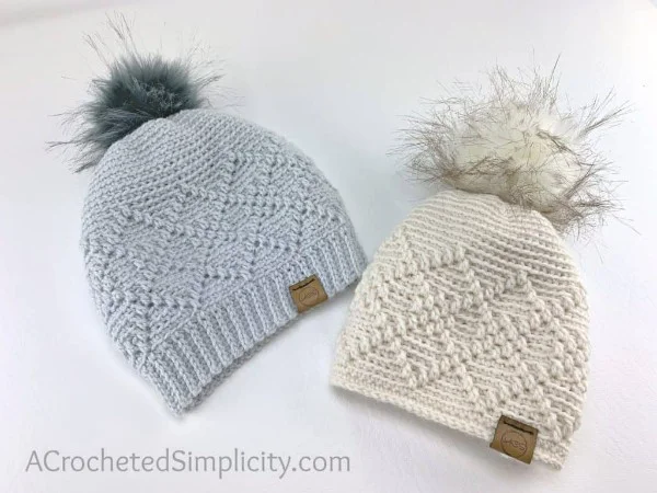 Two crochet hats with raised argyle stitch design.