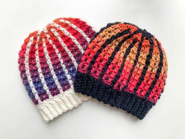 Two striped mosaic crochet hats.