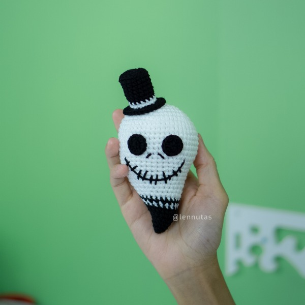 A Jack Skellington themed crochet ghost toy.