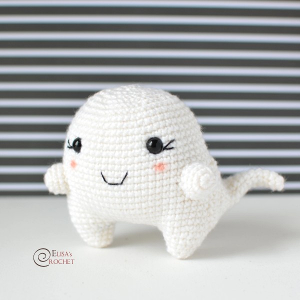 A cute crochet ghost with pink cheeks.