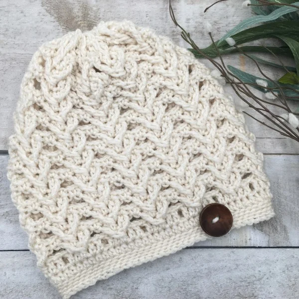 A crochet slouch hat with a textured post stitch design.