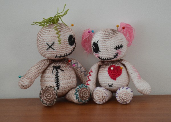 Two crochet voodoo dolls.