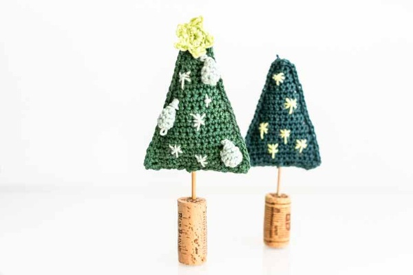 Crochet Christmas trees on cork stands.