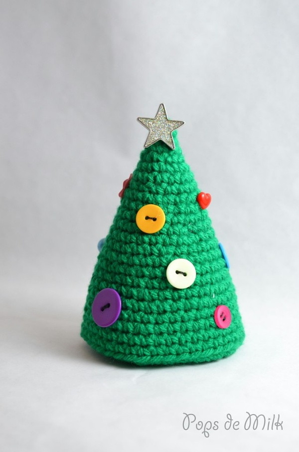 A crochet Christmas tree decorated with buttons.