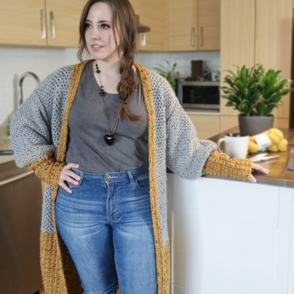 A grey and yellow colourblocked crochet duster.