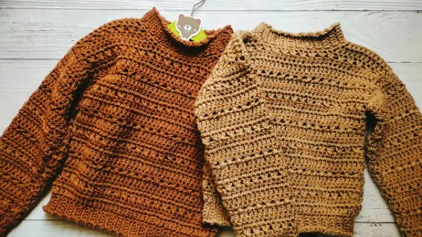 Two different versions of a childs crochet sweater.