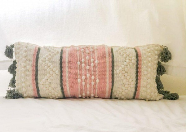 An anthropoly-style bohemian crochet pillow.