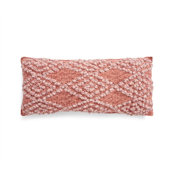 A pink-toned rectangular corchet piloow with a bobble stitch diamond design.
