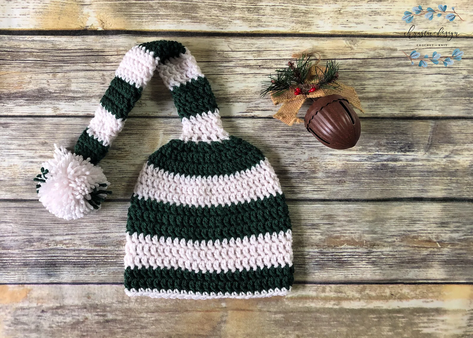 A black and white striped elf hat with pompom.