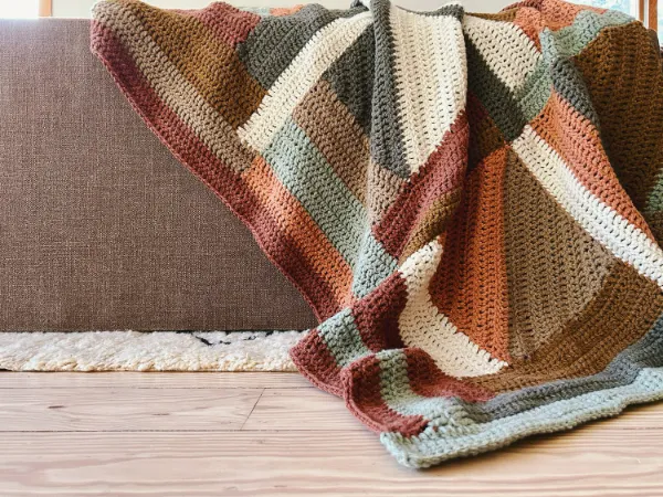 Log-cabin design crochet blanket.