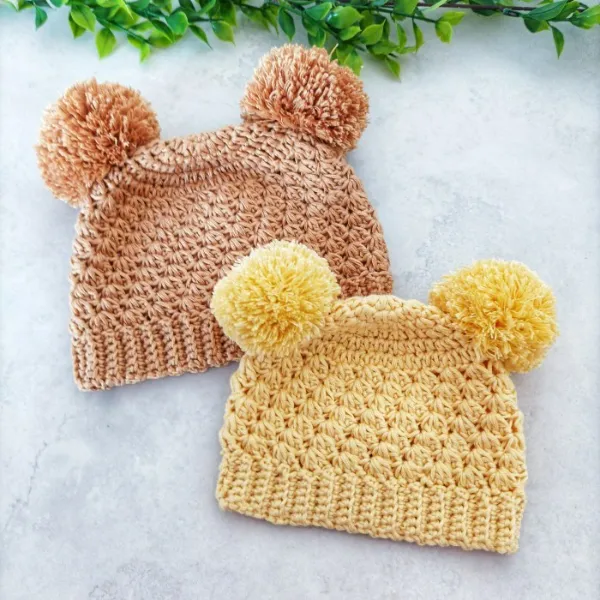 Double pompom children's crochet beanies.