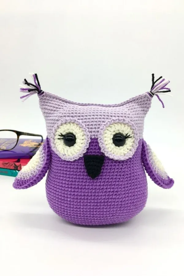 A simply shaped bright purple crochet owl.