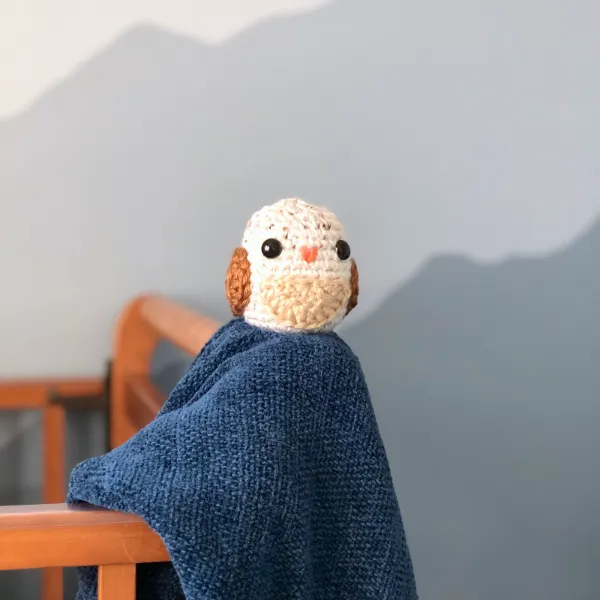 A miniature crochet owl.