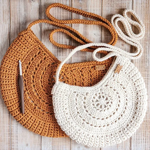 Circle bags with detailed crochet motifs.