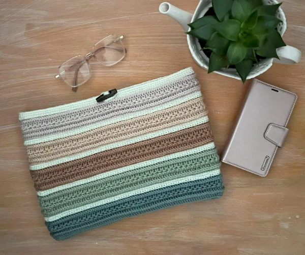 A striped laptop sleeve cover featuring star stitch.