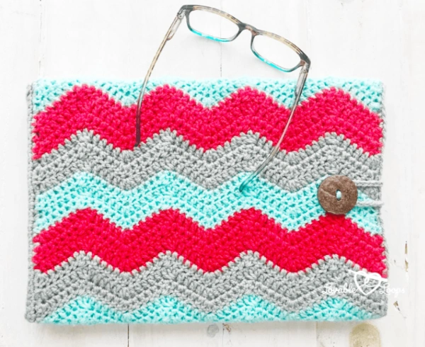 A brightly coloured chevron stitch crochet laptop case.