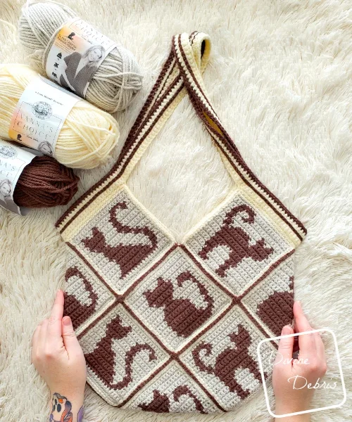 Granny square bag with cat motifs.